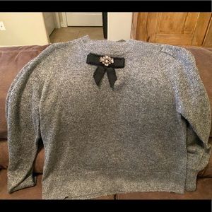 CeCe sweater with jeweled bow detail